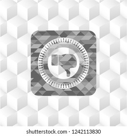 dislike icon inside grey emblem with cube white background