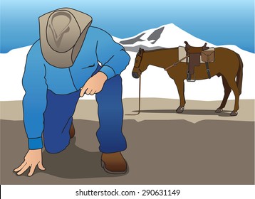 Dismounted cowboy tracker looking for clues on the ground