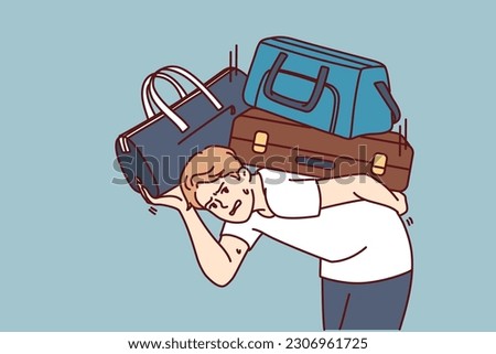 Dissatisfied man with heavy suitcases is moving or relocating to new city. Guy in casual clothes bends over putting suitcases on back and looks at screen in need of help from loader