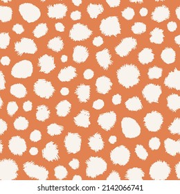 Distracted abstract polka dots seamless repeat pattern. Random placed, irregular vector geometrical shapes all over surface print on orange background.