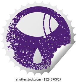 distressed circular peeling sticker symbol of a crying eye looking to one side