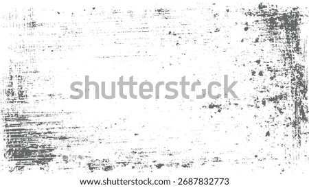 A distressed gray grunge texture with white background and scattered dark speckles and lines.