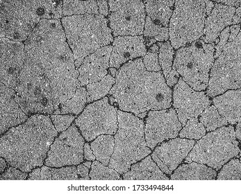 Distressed overlay texture of cracked concrete, stone or asphalt. grunge background. abstract halftone vector illustration