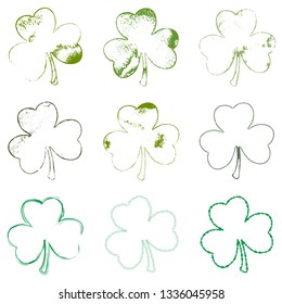 Distressed Patriks Day shamrock design element collection. Set of Clover leaf in grunge style isolated on a white background. Trefoil cutout shabby grainy template. EPS10 vector.