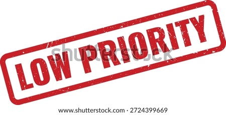 A distressed red rubber stamp impression prominently featuring the text LOW PRIORITY, useful for tasks and document management.