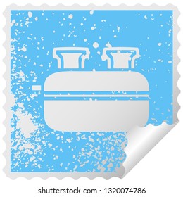 distressed square peeling sticker symbol of a double toaster