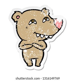 distressed sticker of a cartoon bear showing teeth