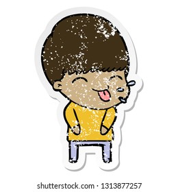 distressed sticker of a cartoon boy sticking out tongue
