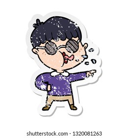 distressed sticker of a cartoon boy wearing spectacles and pointing