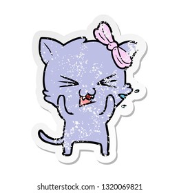 distressed sticker of a cartoon cat