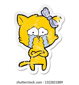 distressed sticker of a cartoon cat