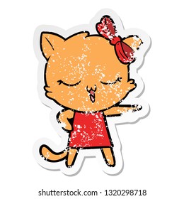 distressed sticker of a cartoon cat with bow on head