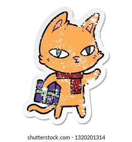 distressed sticker of a cartoon cat with gift