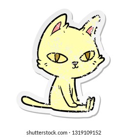 distressed sticker of a cartoon cat sitting