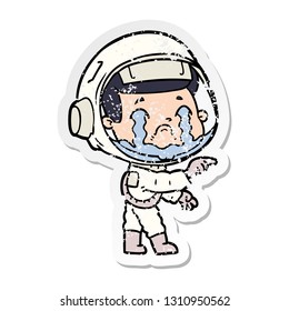 distressed sticker of a cartoon crying astronaut