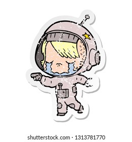 distressed sticker of a cartoon crying astronaut girl