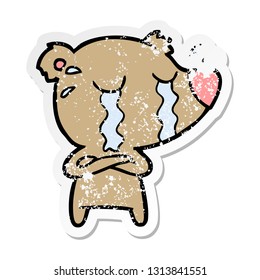 distressed sticker of a cartoon crying bear