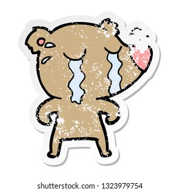 distressed sticker of a cartoon crying bear