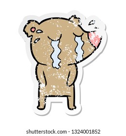 distressed sticker of a cartoon crying bear