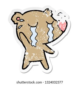 distressed sticker of a cartoon crying bear