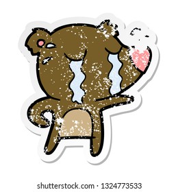 distressed sticker of a cartoon crying bear