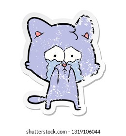 bedrückter Aufkleber einer Karikatur, die eine weinende Katze weint