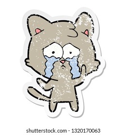 bedrückter Aufkleber einer Karikatur, die eine weinende Katze weint