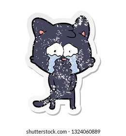 bedrückter Aufkleber einer Karikatur, die eine weinende Katze weint