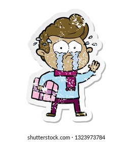 distressed sticker of a cartoon crying man with present