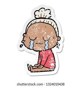 distressed sticker of a cartoon crying old lady
