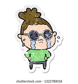 distressed sticker of a cartoon crying woman wearing sunglasses