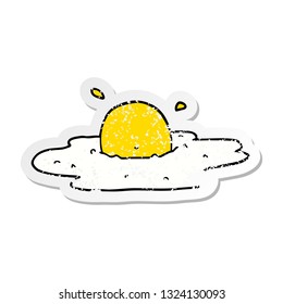 distressed sticker of a cartoon fried egg