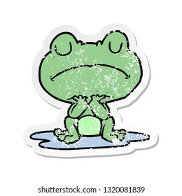 distressed sticker of a cartoon frog in puddle