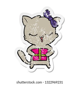distressed sticker of a cartoon girl cat with christmas present