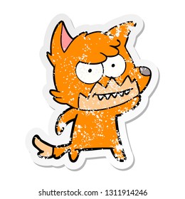 distressed sticker of a cartoon grinning fox