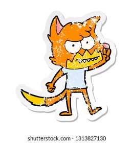 distressed sticker of a cartoon grinning fox