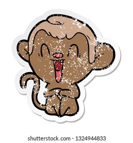 distressed sticker of a cartoon laughing monkey