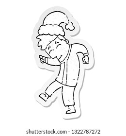 distressed sticker of a cartoon man wearing christmas hat