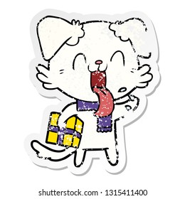 distressed sticker of a cartoon panting dog with present