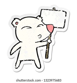 distressed sticker of a cartoon polar bear with placard