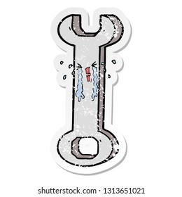 distressed sticker of a cartoon spanner