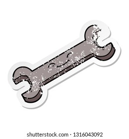 distressed sticker of a cartoon spanner