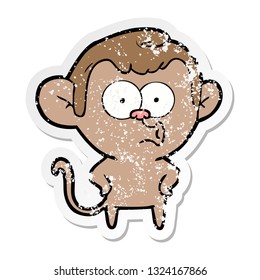 distressed sticker of a cartoon surprised monkey
