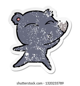 distressed sticker of a cartoon whistling bear