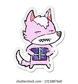 distressed sticker of a cartoon wolf with a gift