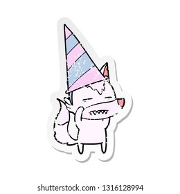 distressed sticker of a cartoon wolf in party hat