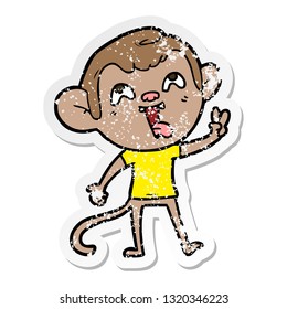 distressed sticker of a crazy cartoon monkey giving peace sign
