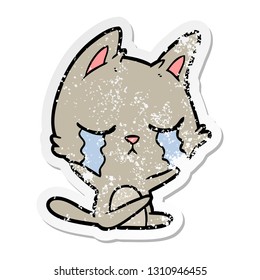 distressed sticker of a crying cartoon cat