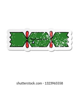 distressed sticker of a cute cartoon christmas cracker