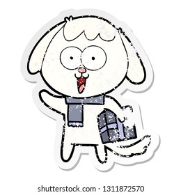 distressed sticker of a cute cartoon dog with christmas present